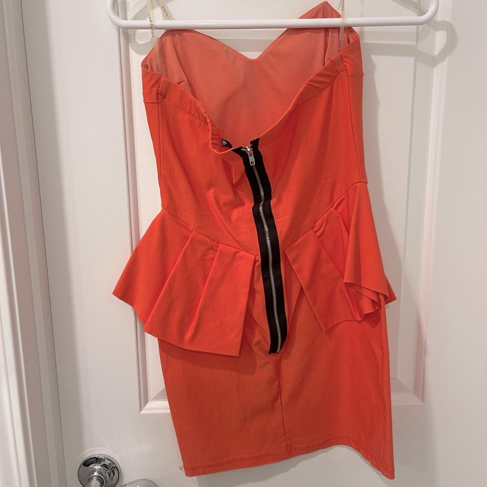Love Culture size medium peachy orange strapless peplum dress